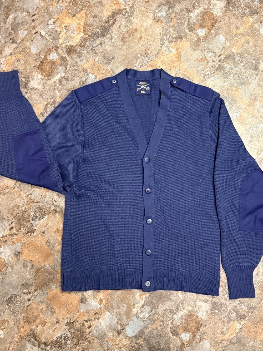 Military Equipment of America by Melos and Estey. blue cardigan